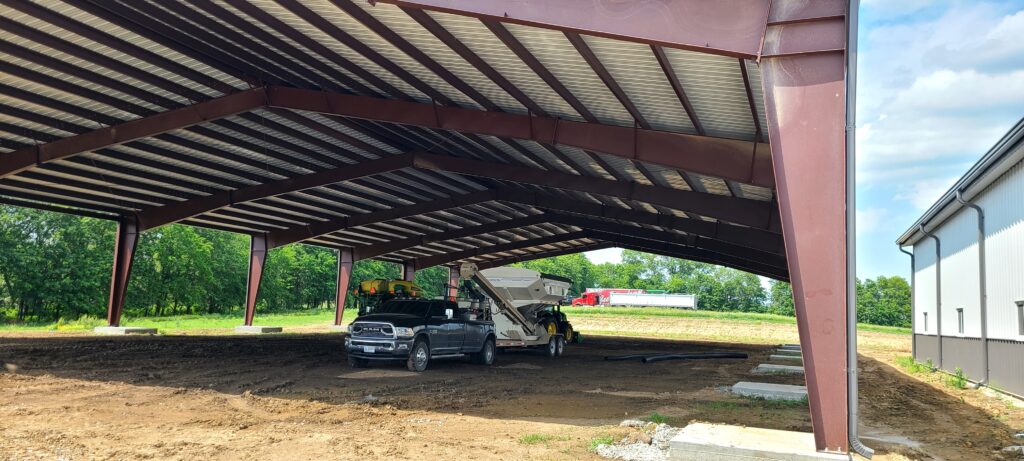 100'x180'x18' Missouri metal ag Building roof installation from topline steel buildings